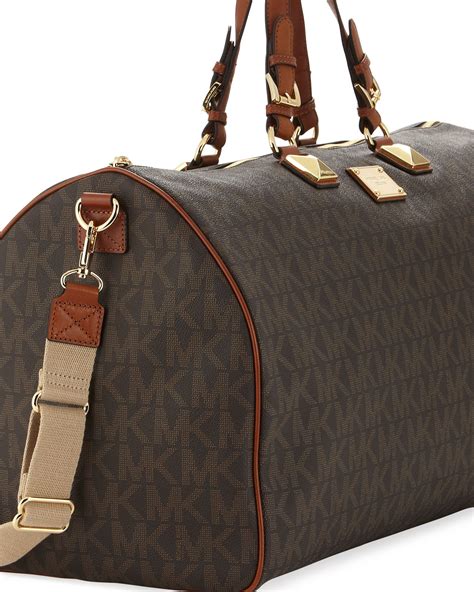 black michael kors duffle bag|Michael Kors large suitcase.